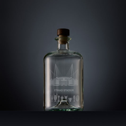 Engraved apothecary-style decanter with Etihad stadium and trophies illustration 