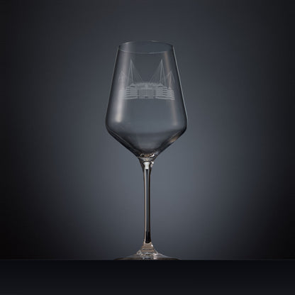 Engraved wine glass featuring a line-art illustration of the Etihad Stadium, shown on a dark background