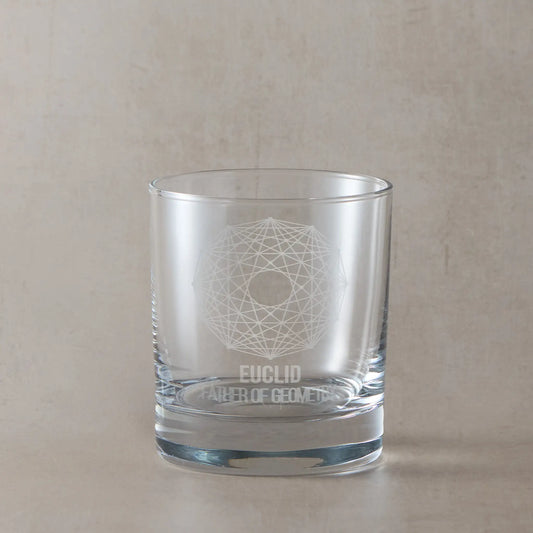 Whisky glass engraved with a geometrical design based on Euclids Mathematics, photographed on a neutral background