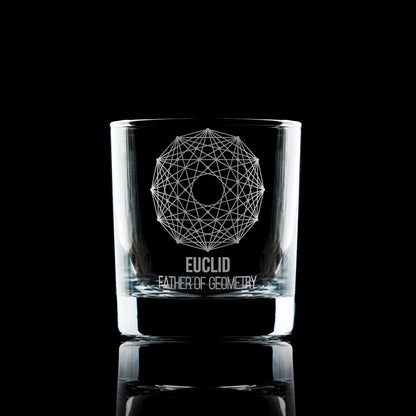 Engraved whisky glass featuring a geometric Dodecagram and Euclid inscription, photographed on black to highlight engraving clarity.