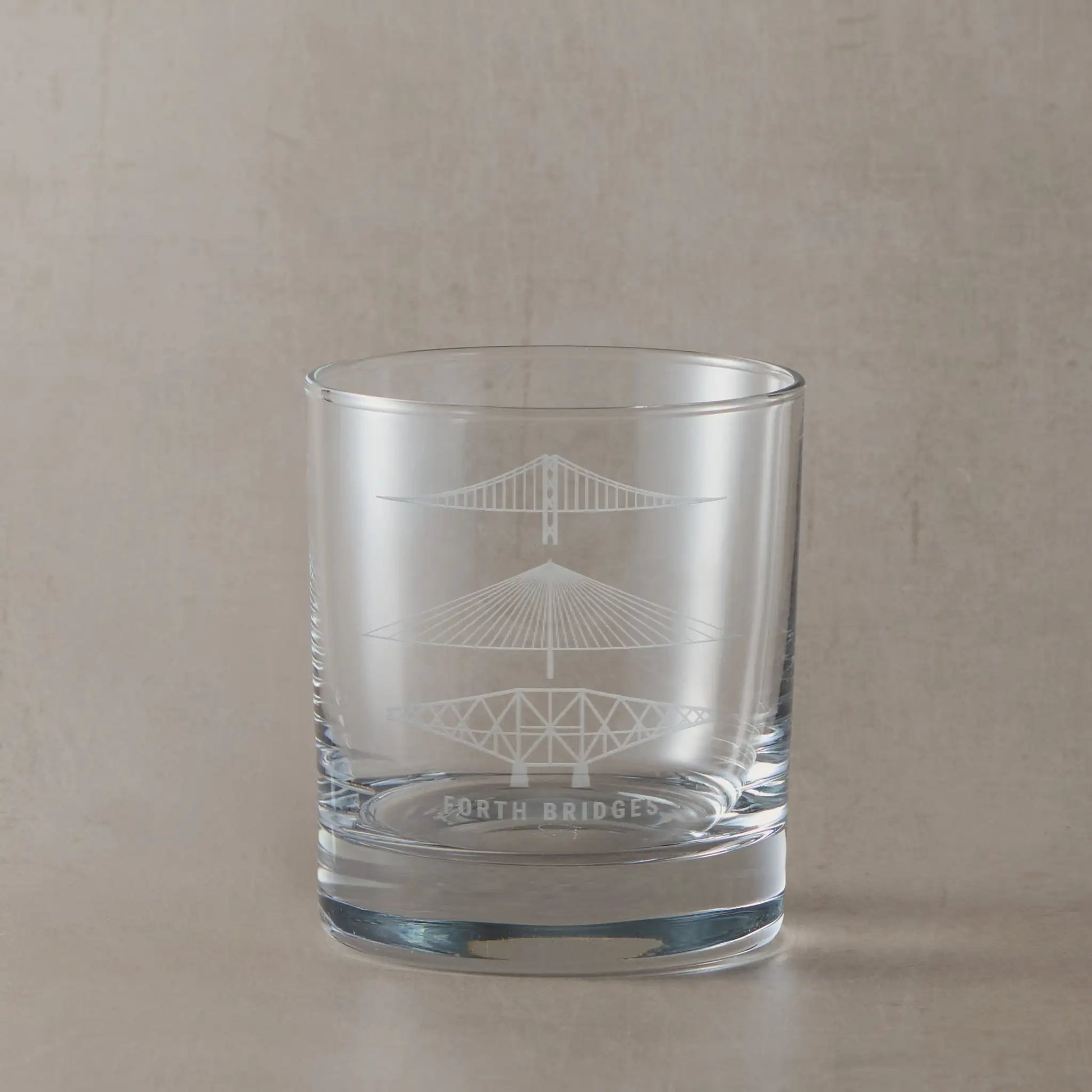 Whisky glass engraved with three of Scotland's  forth bridges