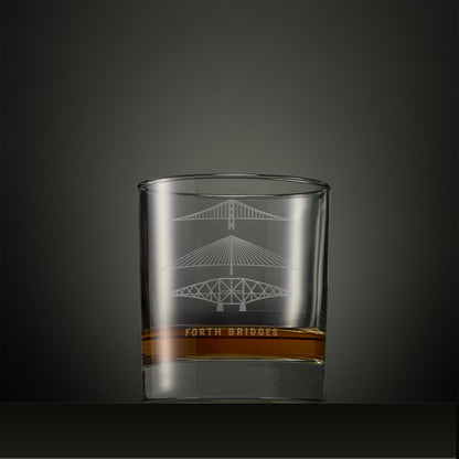 Clear glass tumbler with engraved design and 'Forth Bridges' text on a dark background