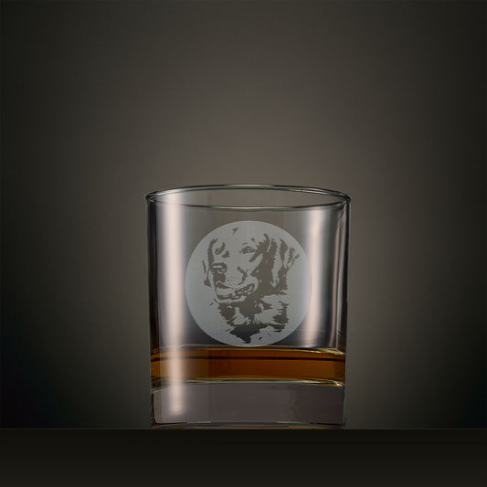 Engraved whisky glass featuring a Golden Retriever portrait set within a circular design, photographed on a studio background