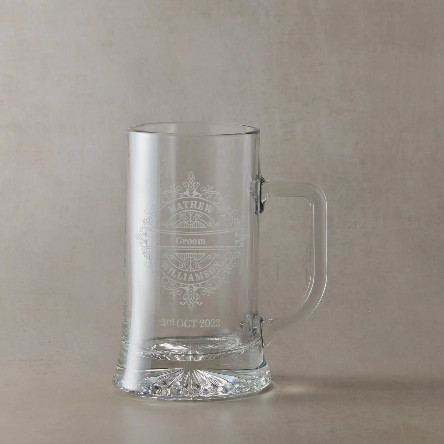 Tankard engraved with venetian lace design, grooms name and wedding date, shown on a neutral background