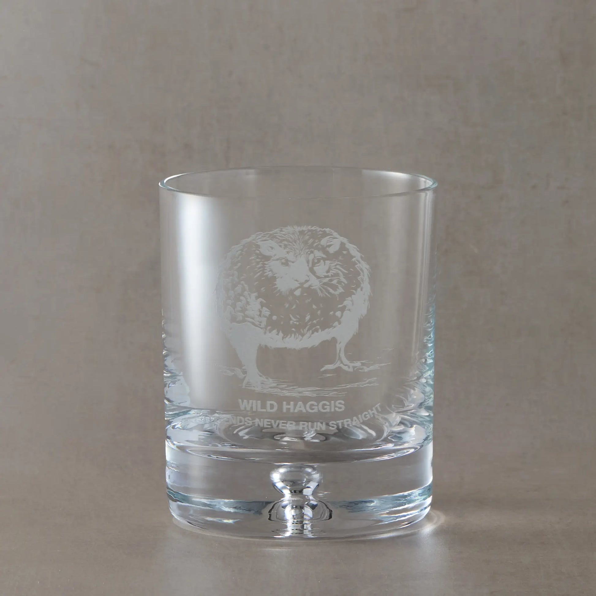 Scottish whisky glass engraved with a wild haggis and the words legends never run straight
