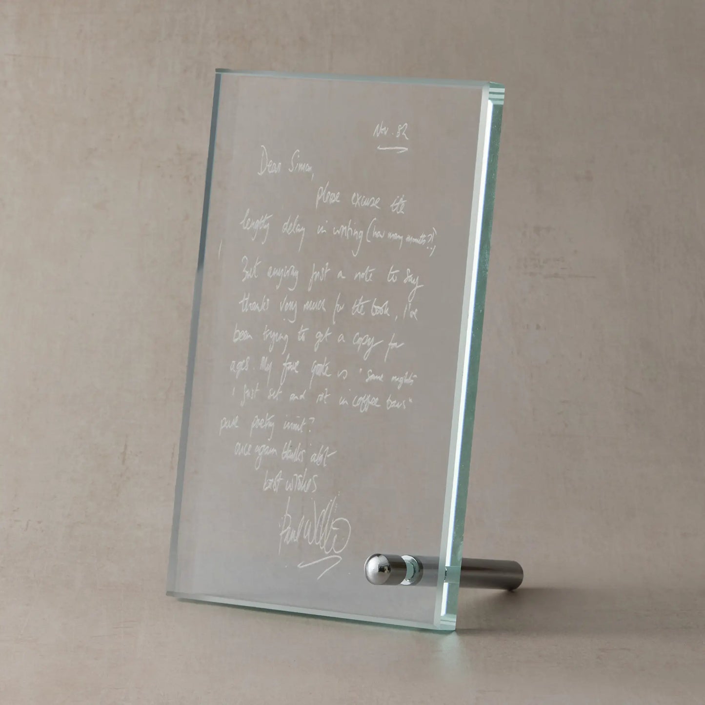 Glass display plaque engraved with a scanned handwritten letter, shown on a soft neutral studio background