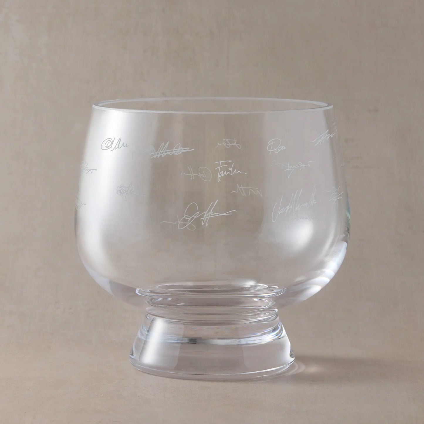Engraved presentation bowl featuring real handwritten signatures, arranged around the glass.