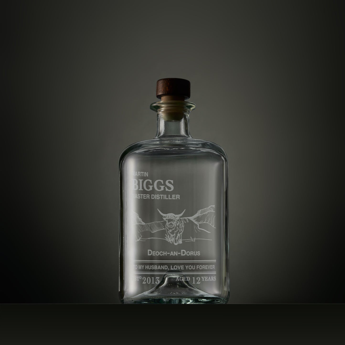 Engraved apothecary-style decanter with a Highland cow, Gaelic text and personalised message