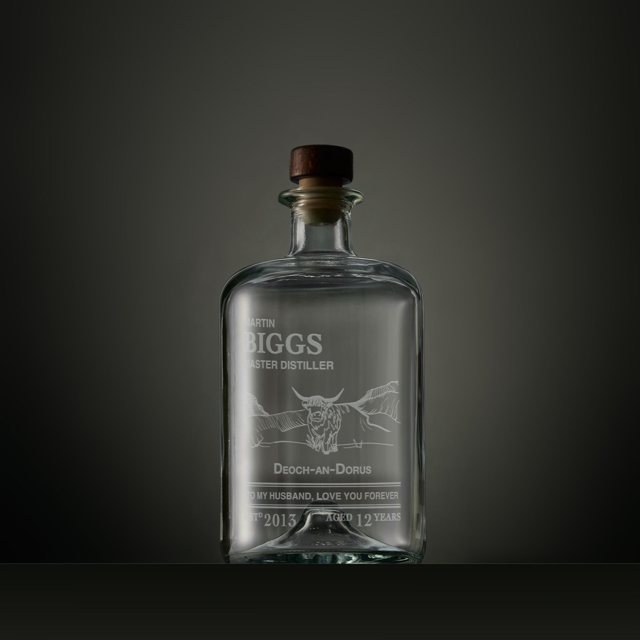 Engraved apothecary-style decanter with a Highland cow, Gaelic text and personalised message