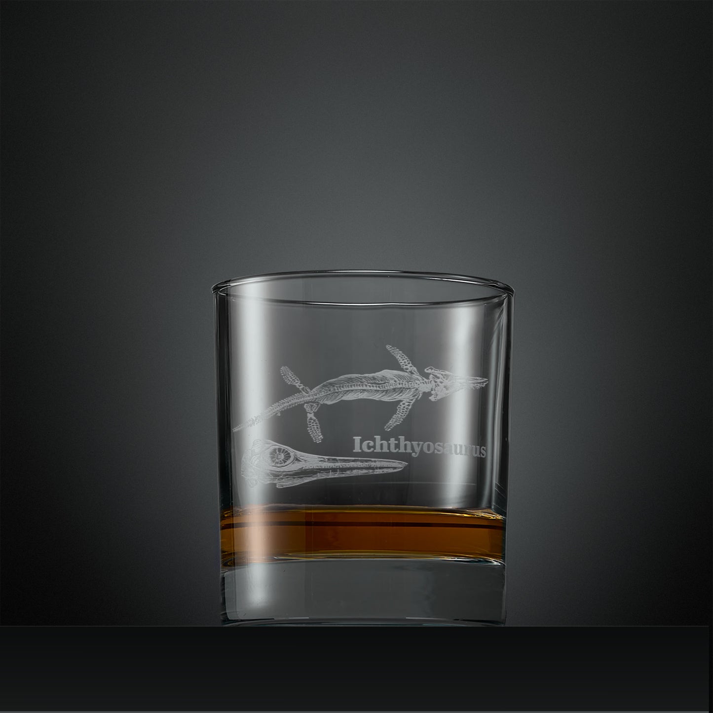 Engraved whisky glass with  Ichthyosaurus fossil design