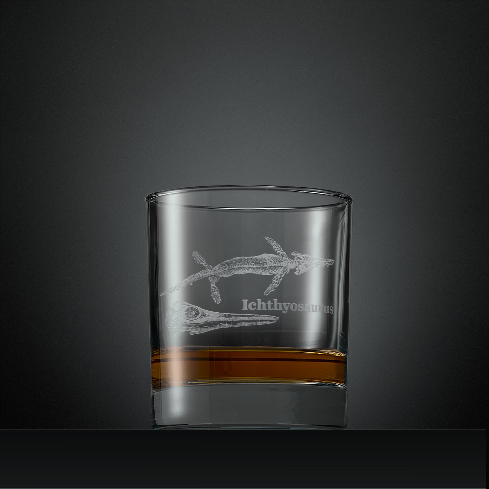 Engraved whisky glass with  Ichthyosaurus fossil design