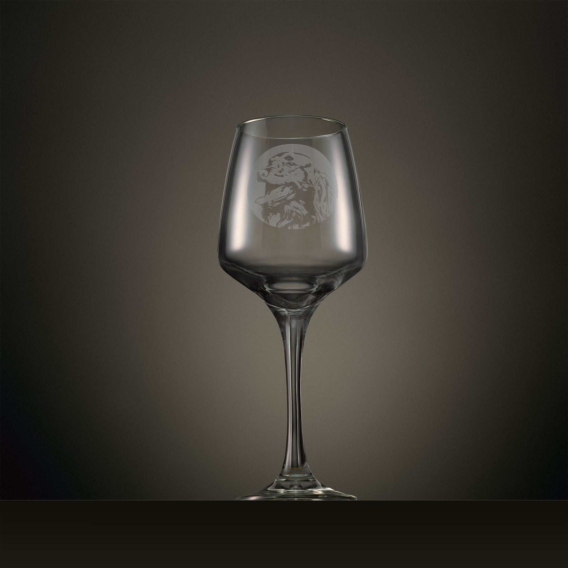 Engraved wine glass featuring a portrait Irish Red Setter design, shown on a dark studio background