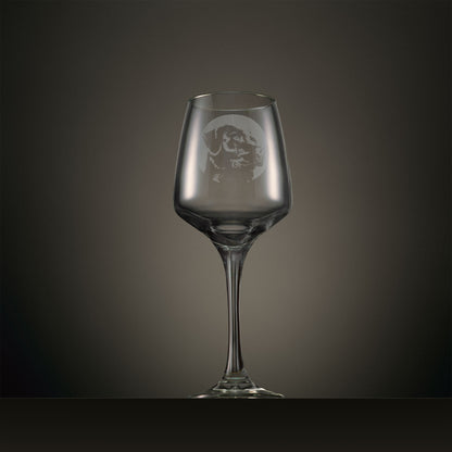 Engraved wine glass featuring a portrait Labrador design, shown on a dark studio background