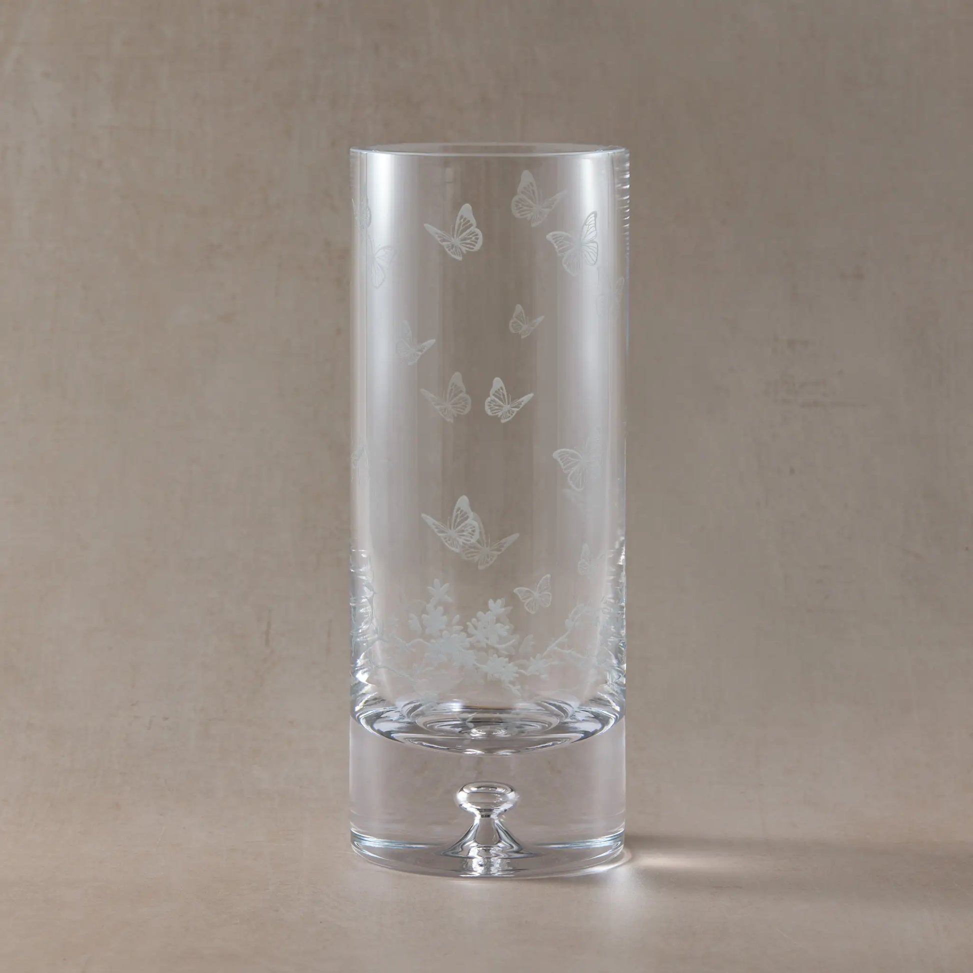 Engraved flower vase featuring butterflies, birds and blossom 