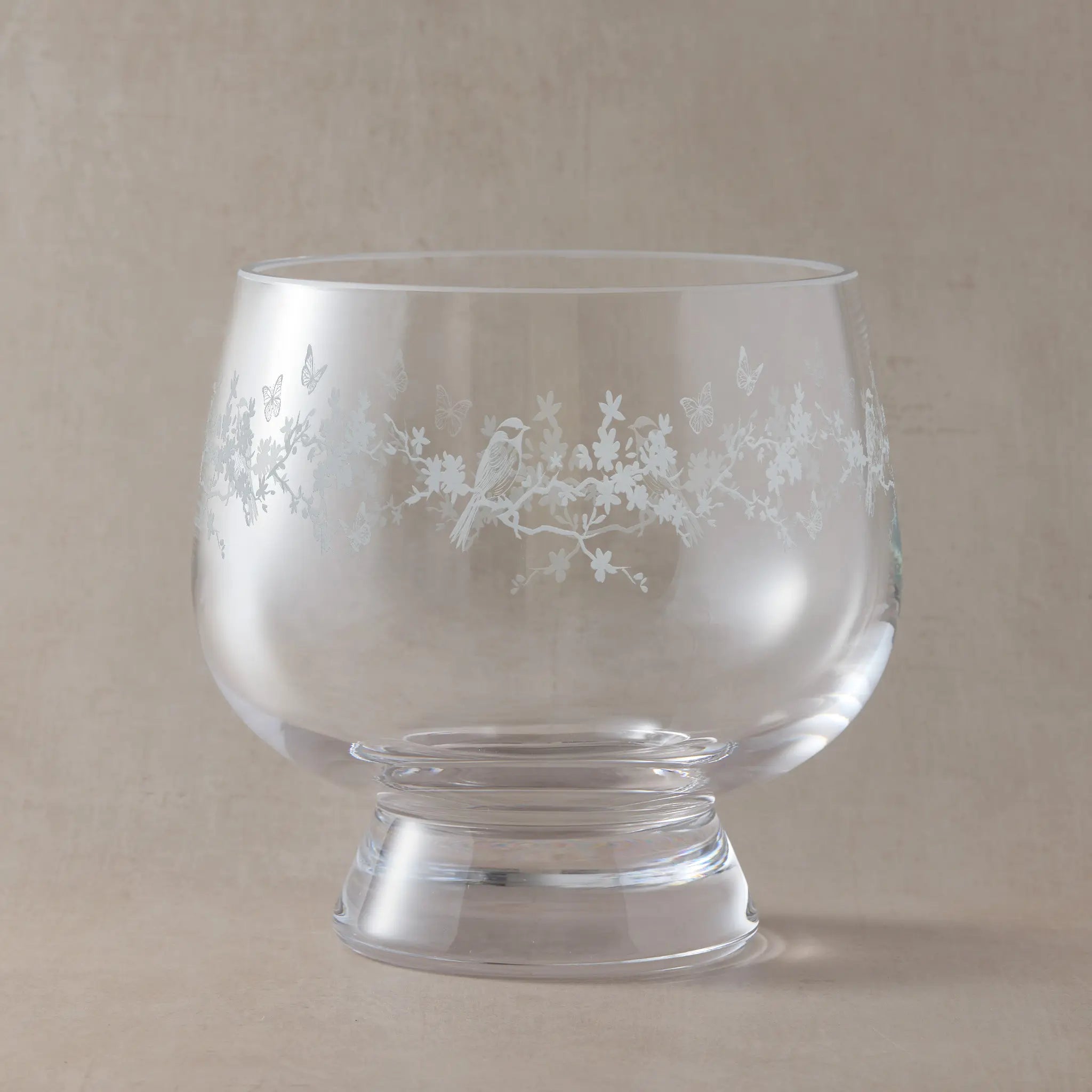 Engraved presentation bowl with floral garland, butterflies, and garden birds, wrapped around the glass.