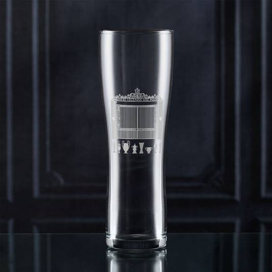 Pint glass with engraved LFC shankly gates and championship trophies design on a dark background