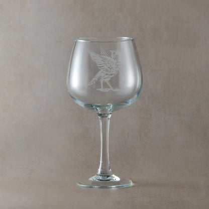 Gin glass engraved with a Liverbird facing right, photographed on a light background