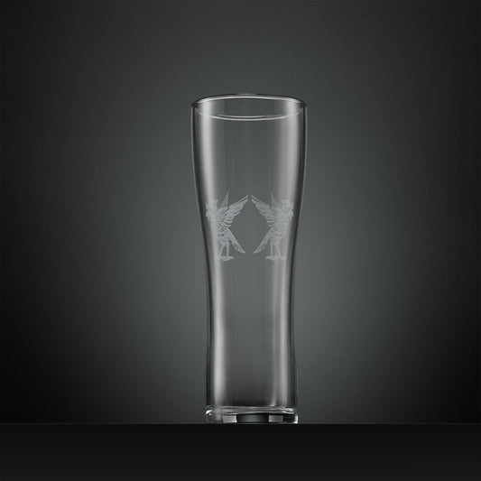 Clear tall pint glass with two engraved Liverbirds facing away from each other on a dark gray background