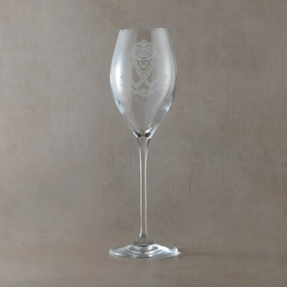 Engraved Scottish Luckenbooth prosecco glass featuring entwined hearts, a crown, stag's head and thistle motifs