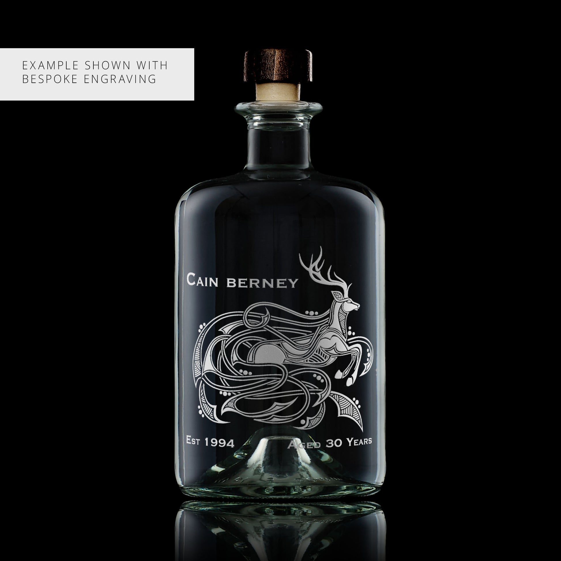 Personalised engraved stag decanter with intricate knotwork design on a black background