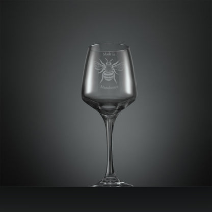 Engraved wine glass with Manchester Bee and text