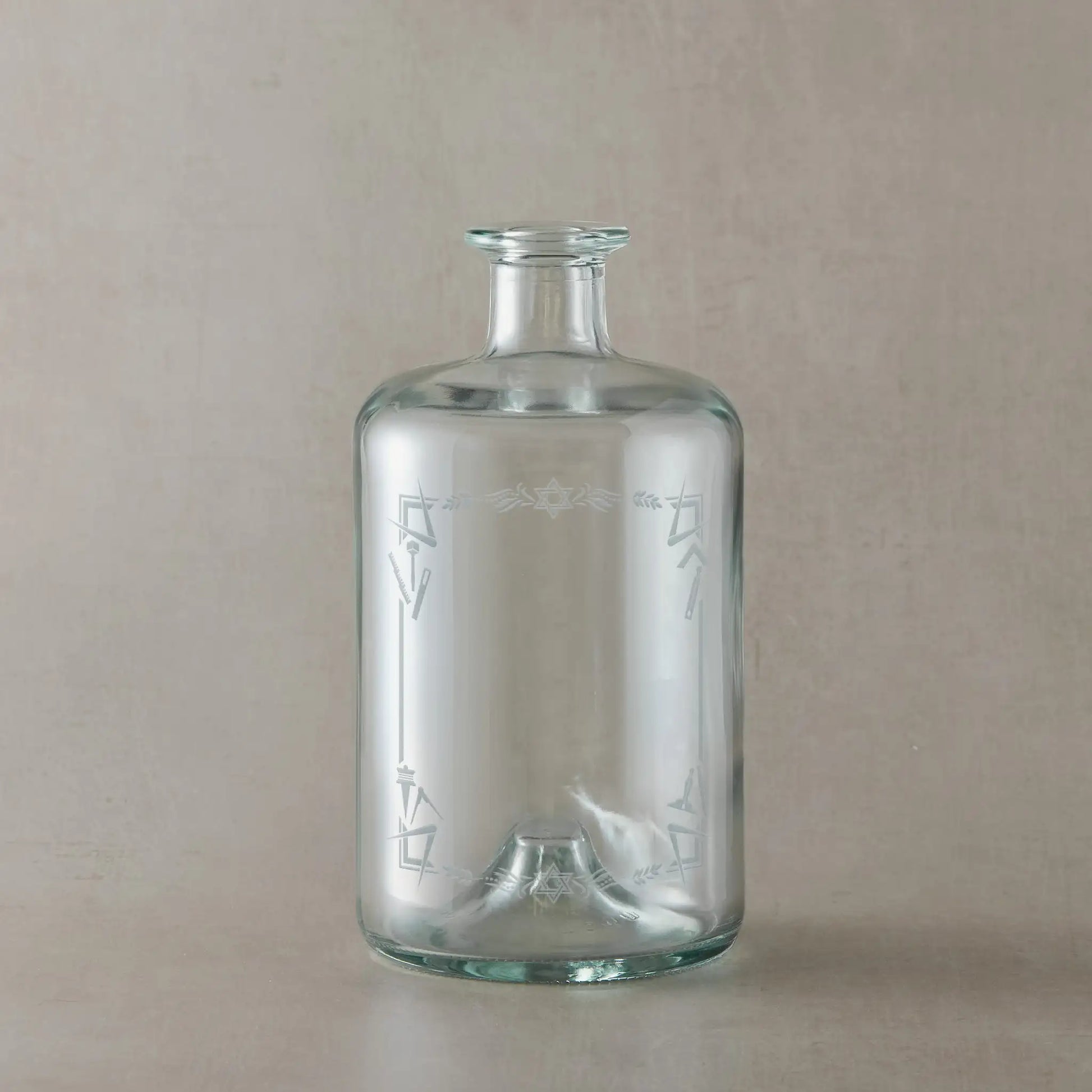 Apothecary decanter engraved with a border of working tools, acacia leaves, square and compass and the Star of David.