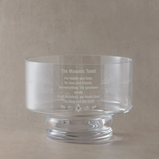 Clear glass presentation bowl with Masonic Lodge toast text on a beige background
