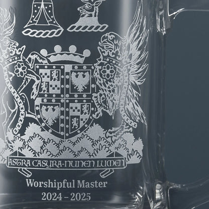 Close-up of hand sandblasted engraving showing fine detail of Masonic lodge crest on glass tankard