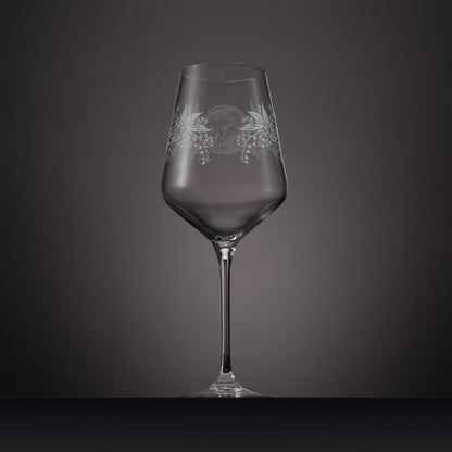 Engraved wine glass featuring Lily of the valley and a dormouse