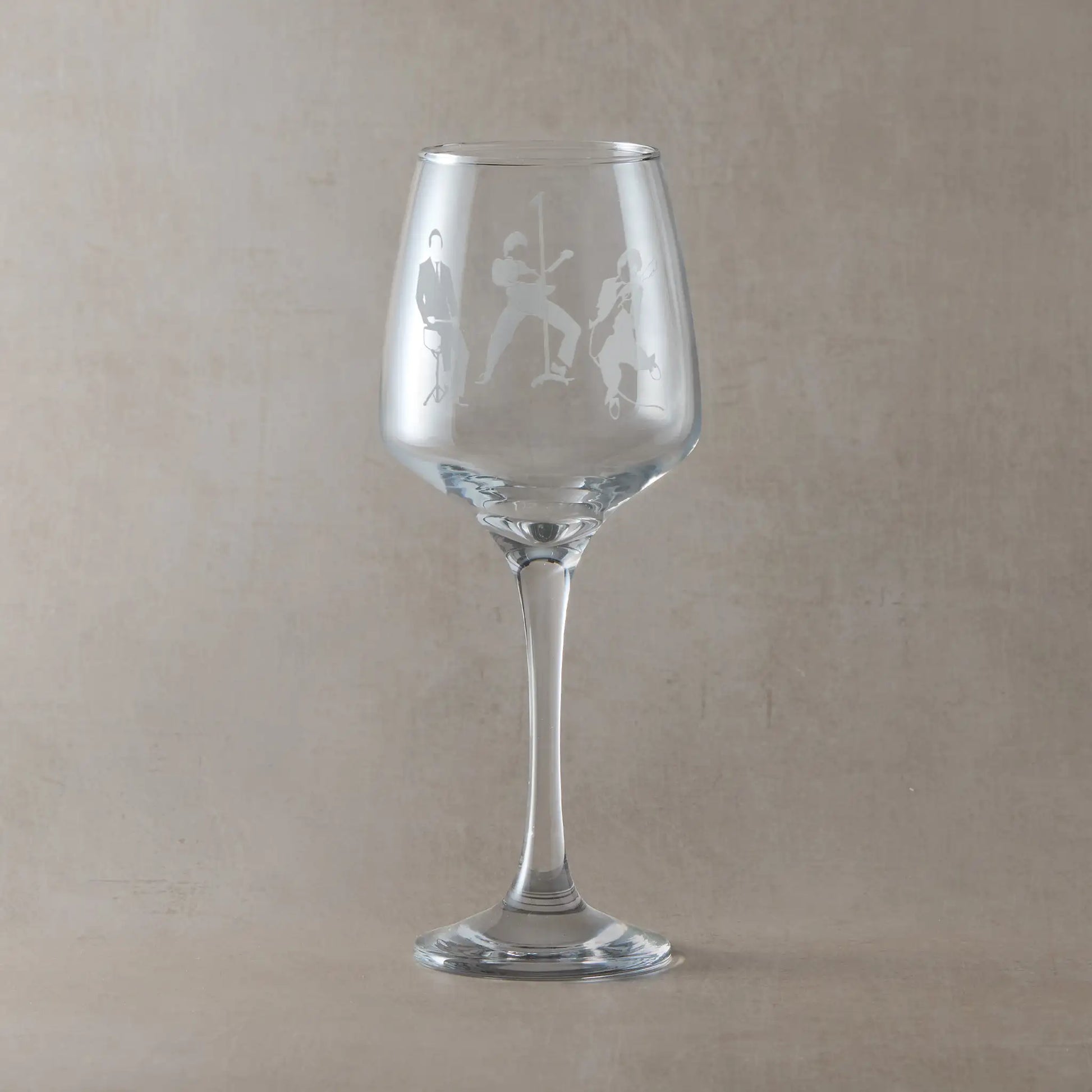 Engraved wine glass featuring a silhouette of a three-piece band – inspired by mod revival style, with guitar, bass, and drums