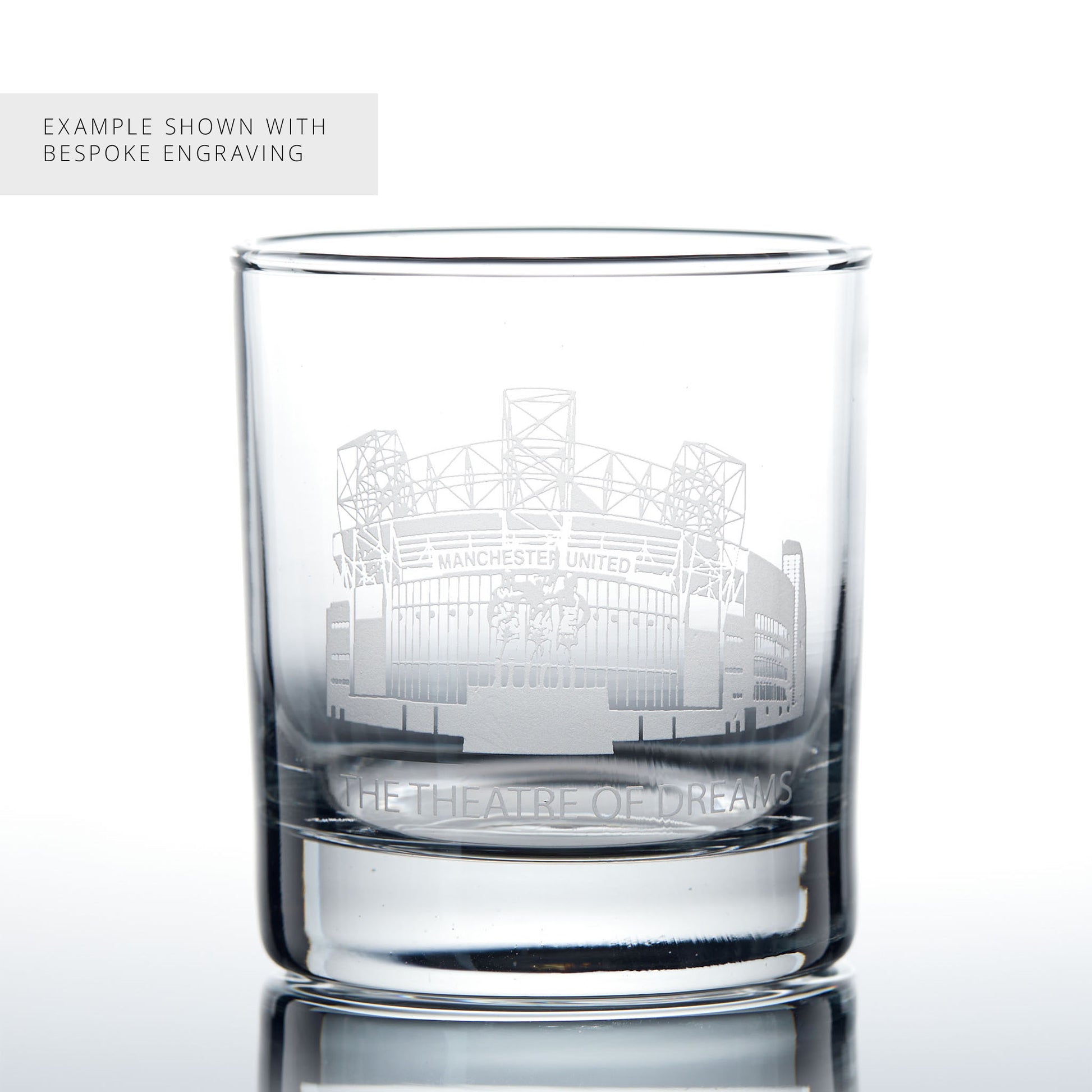 Example of bespoke engraving on a whisky glass featuring a line-art interpretation of Old Trafford.