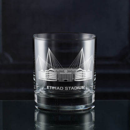 Manchester whisky tumbler engraved with a line-art interpretation of the Etihad Stadium, with space for personalisation.