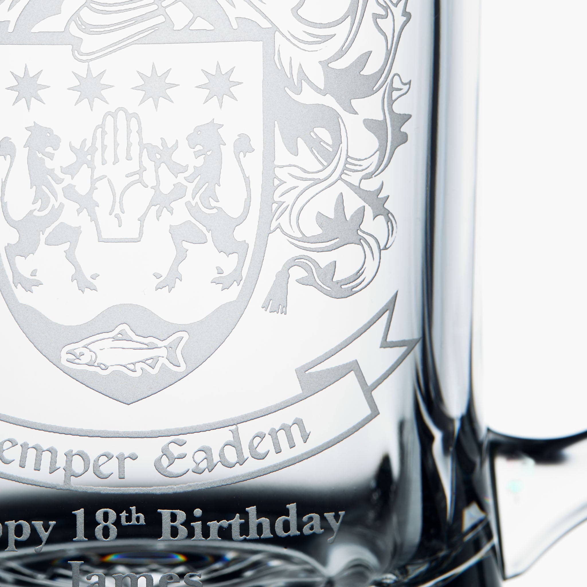 Detail of personalised engraving in a custom coat of arms, family crest glass tankard