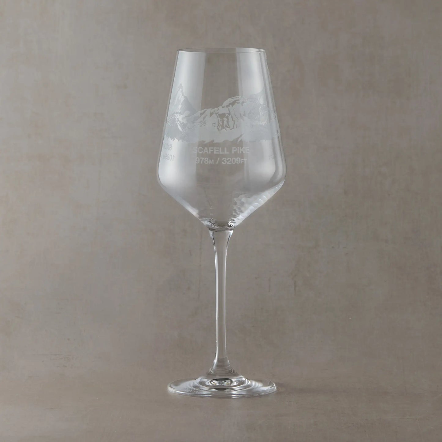 Engraved wine glass featuring a wraparound National Three Peaks design with Scafell Pike facing forward.