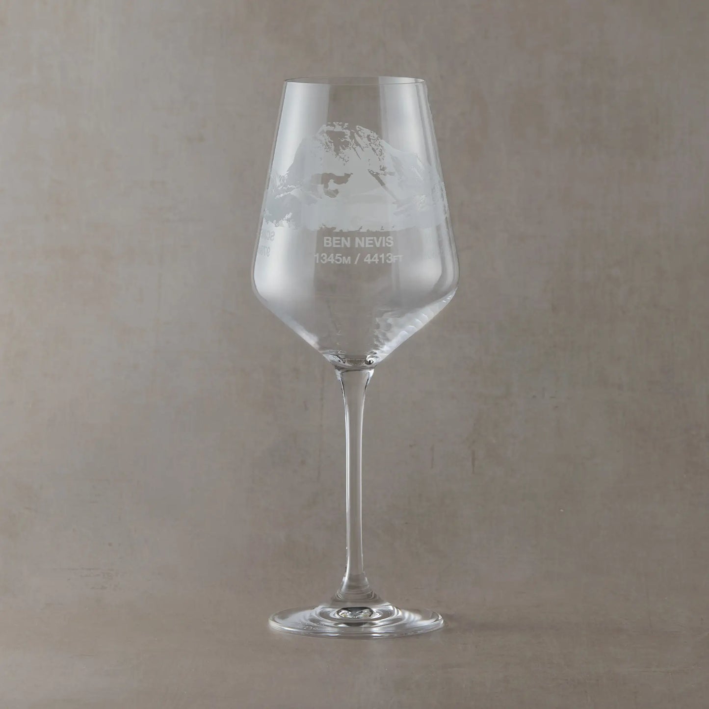 Engraved wine glass featuring a wraparound National Three Peaks design with Ben Nevis facing forward.