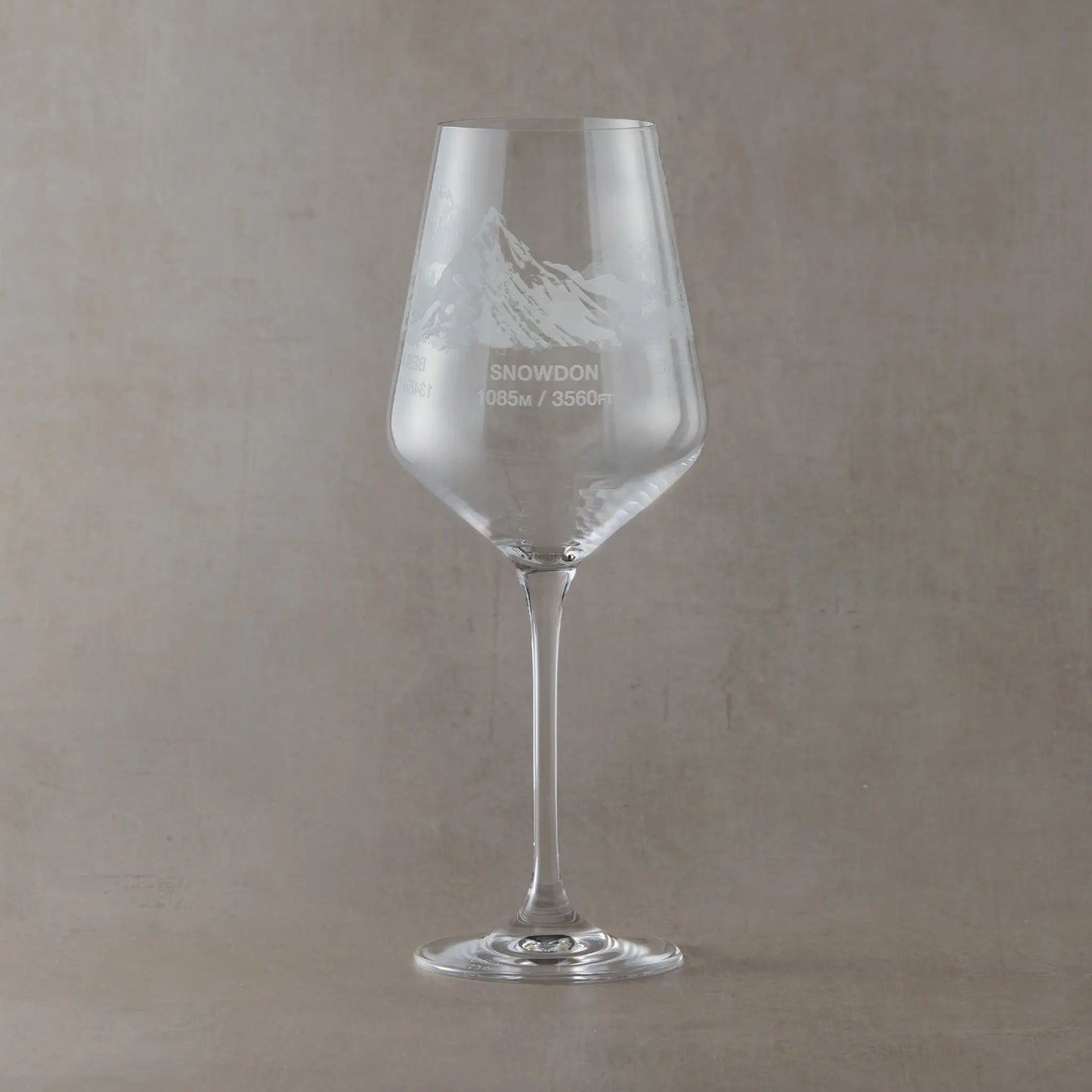 Engraved wine glass featuring a wraparound National Three Peaks design with Snowdon facing forward.