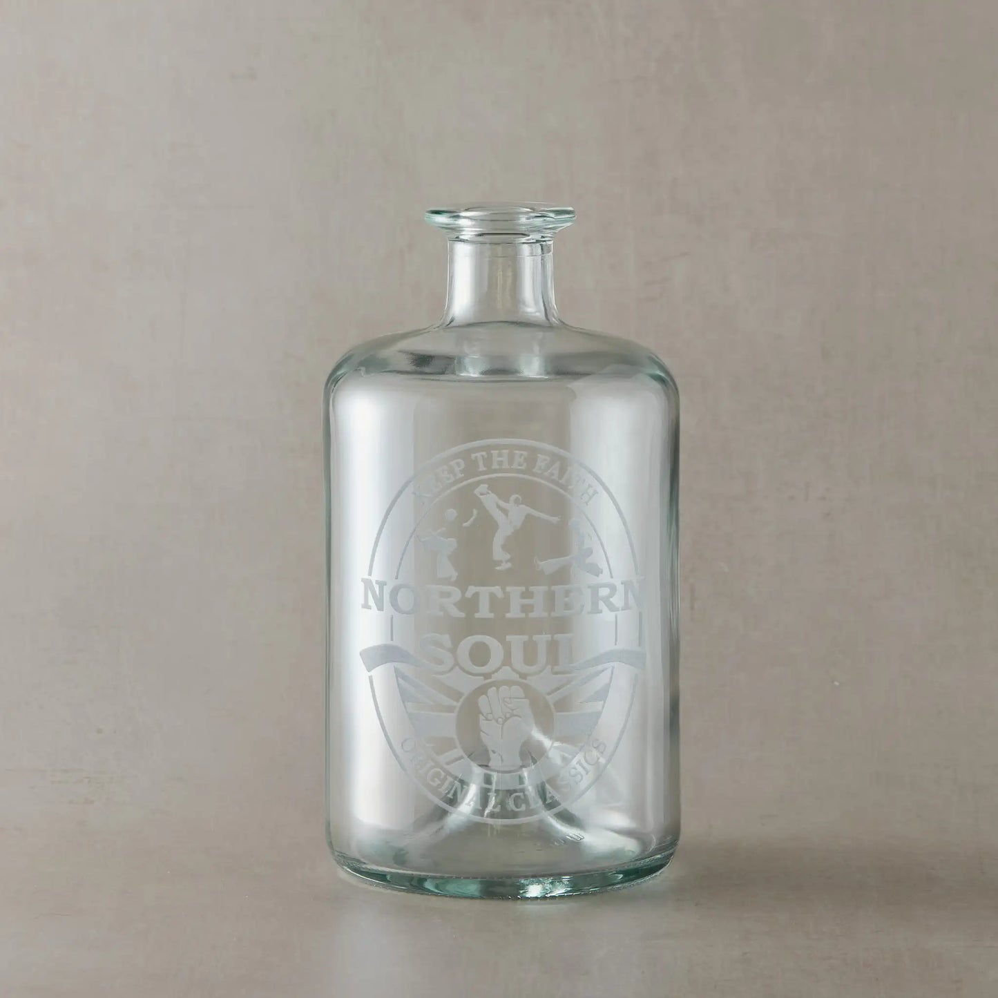Decanter, apothecary style bottle with a Northern Soul clenched fist design on a pale background
