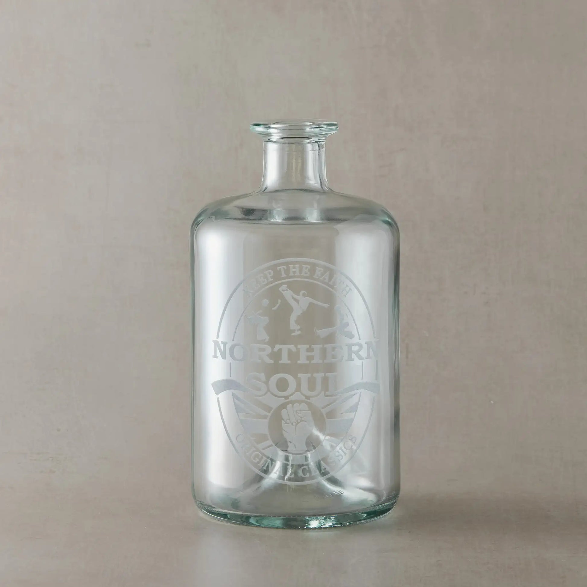 Decanter, apothecary style bottle with a Northern Soul clenched fist design on a pale background