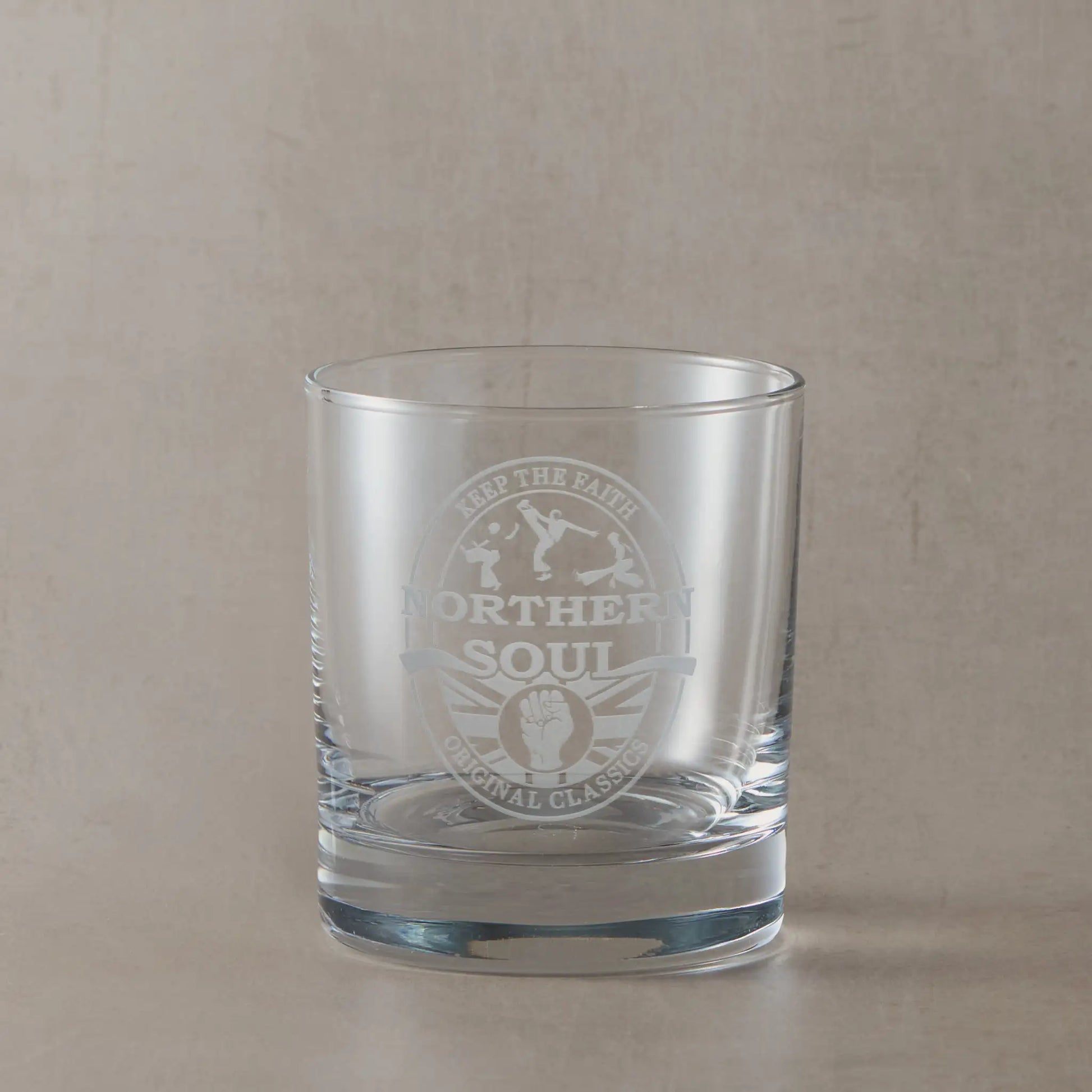 Engraved whisky glass with Northern Soul oval beer mat design featuring clenched fist, Union Jack, silhouette dancers, and “Keep the Faith / Original Classics” text