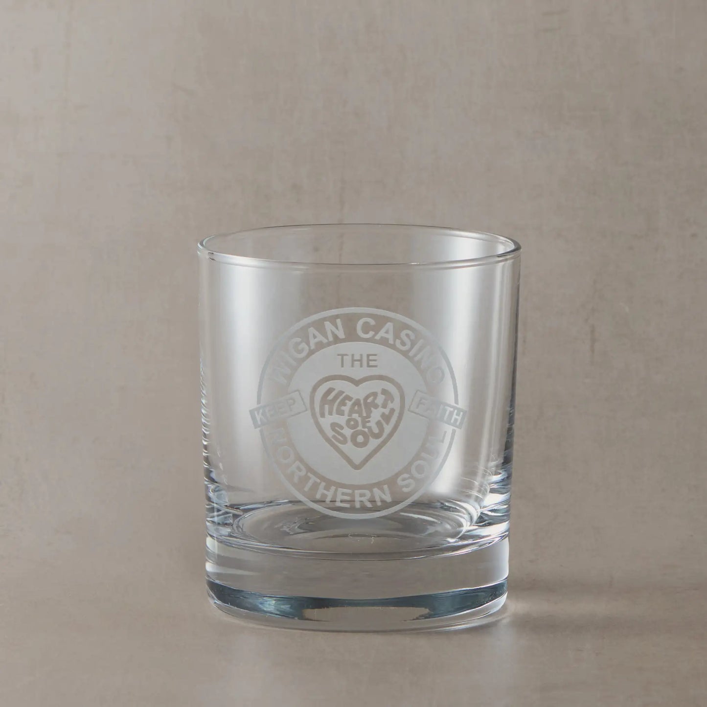 Whisky glass engraved with heart and soul, Northern Soul  Keep The Faith design on a beige background