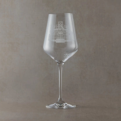 Wine glass with engraved Old Trafford design on a light background