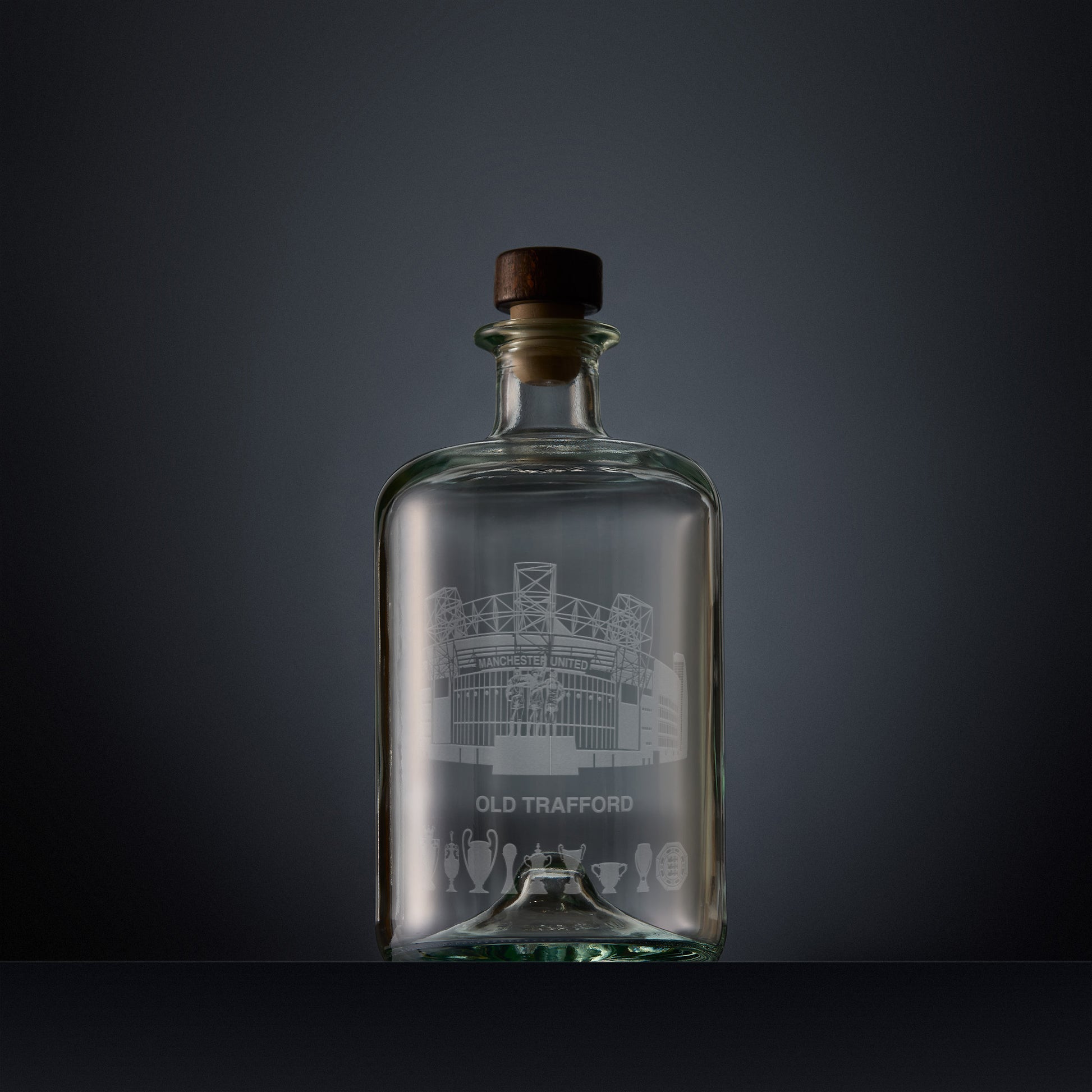 Engraved apothecary-style decanter with Old Trafford stadium and trophies illustration 