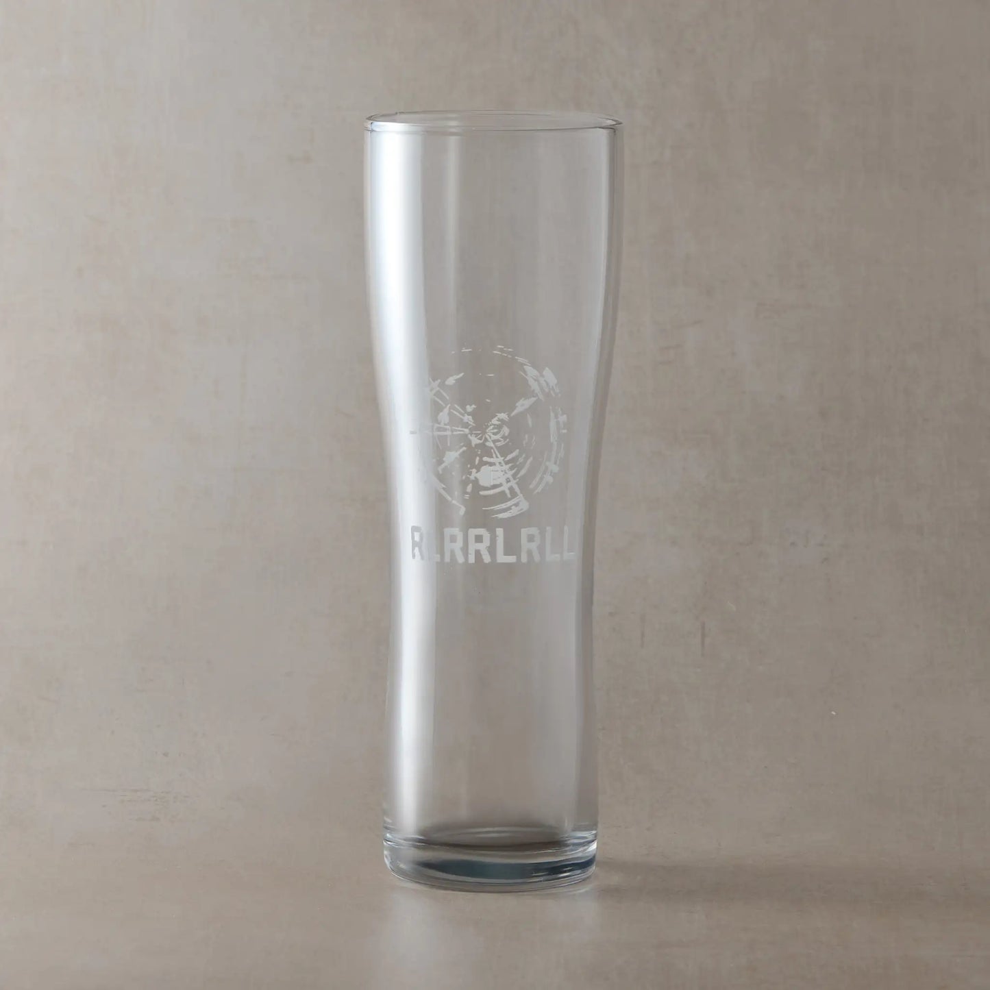 Engraved pint glass featuring a cymatic style drumhead vibration pattern