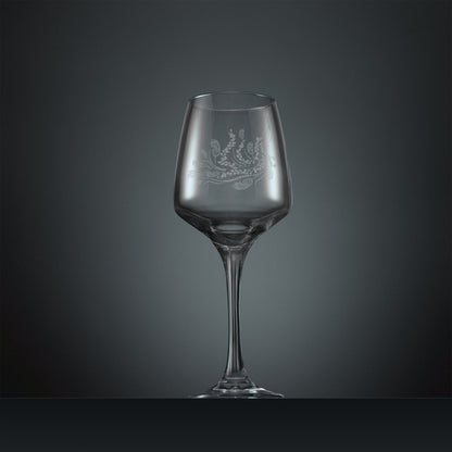 Engraved wine glass with a peacock, trailing leaves and feathers design