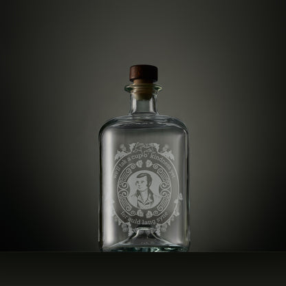 Engraved apothecary-style decanter with engraved portrait of Robert Burns surrounded by thistles