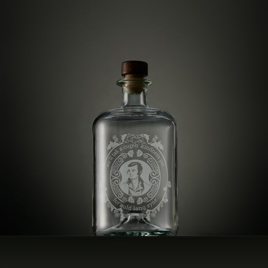 Engraved apothecary-style decanter with engraved portrait of Robert Burns surrounded by thistles