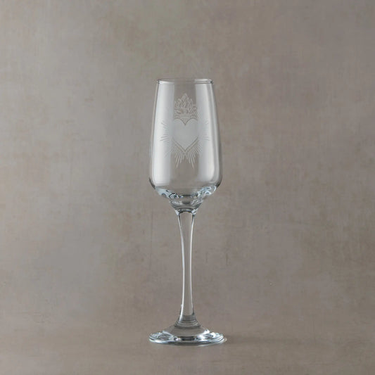 Engraved prosecco glass featuring a traditional Milagro Heart design with intricate folk-style details