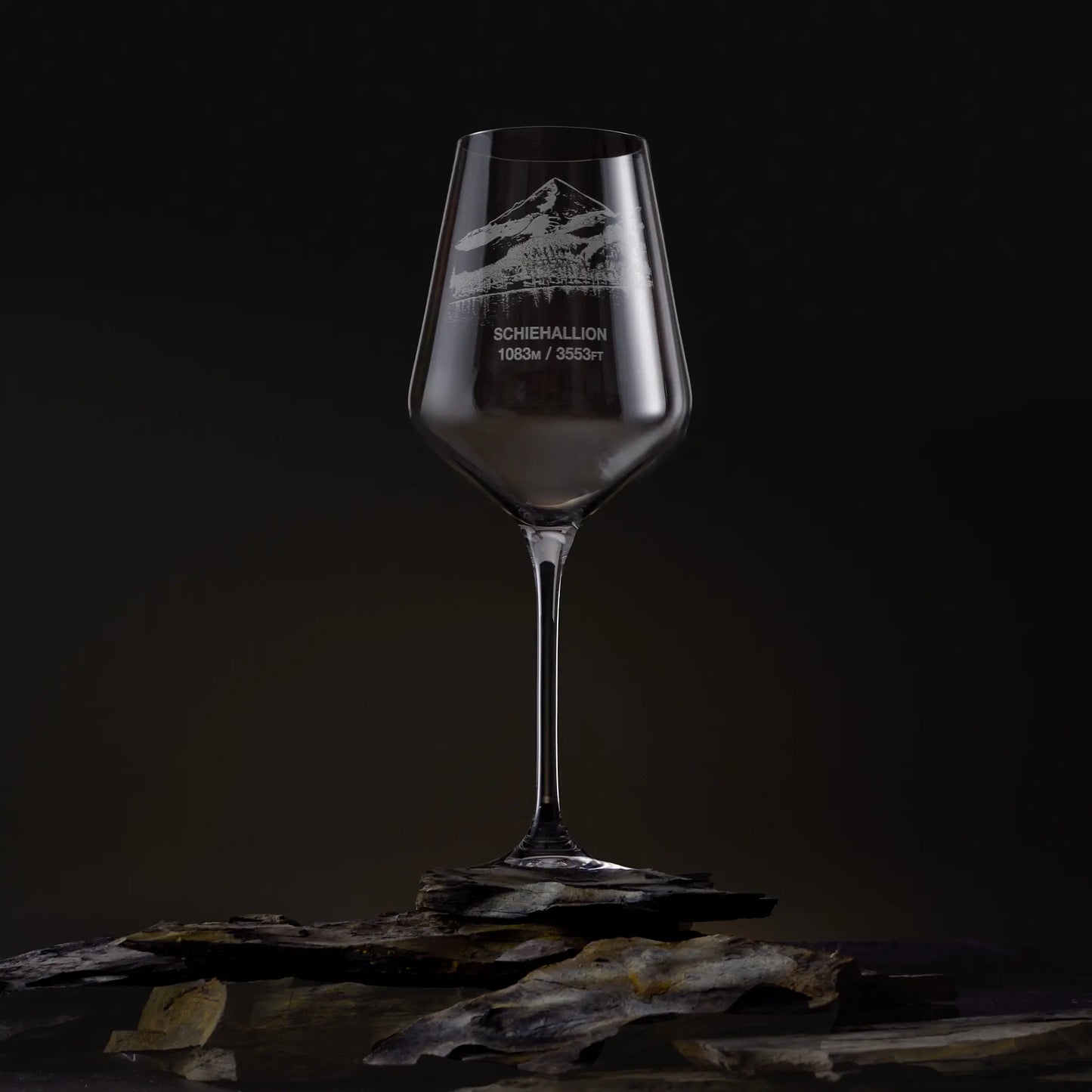 Hand-engraved Schiehallion wine glass on a dark, studio background
