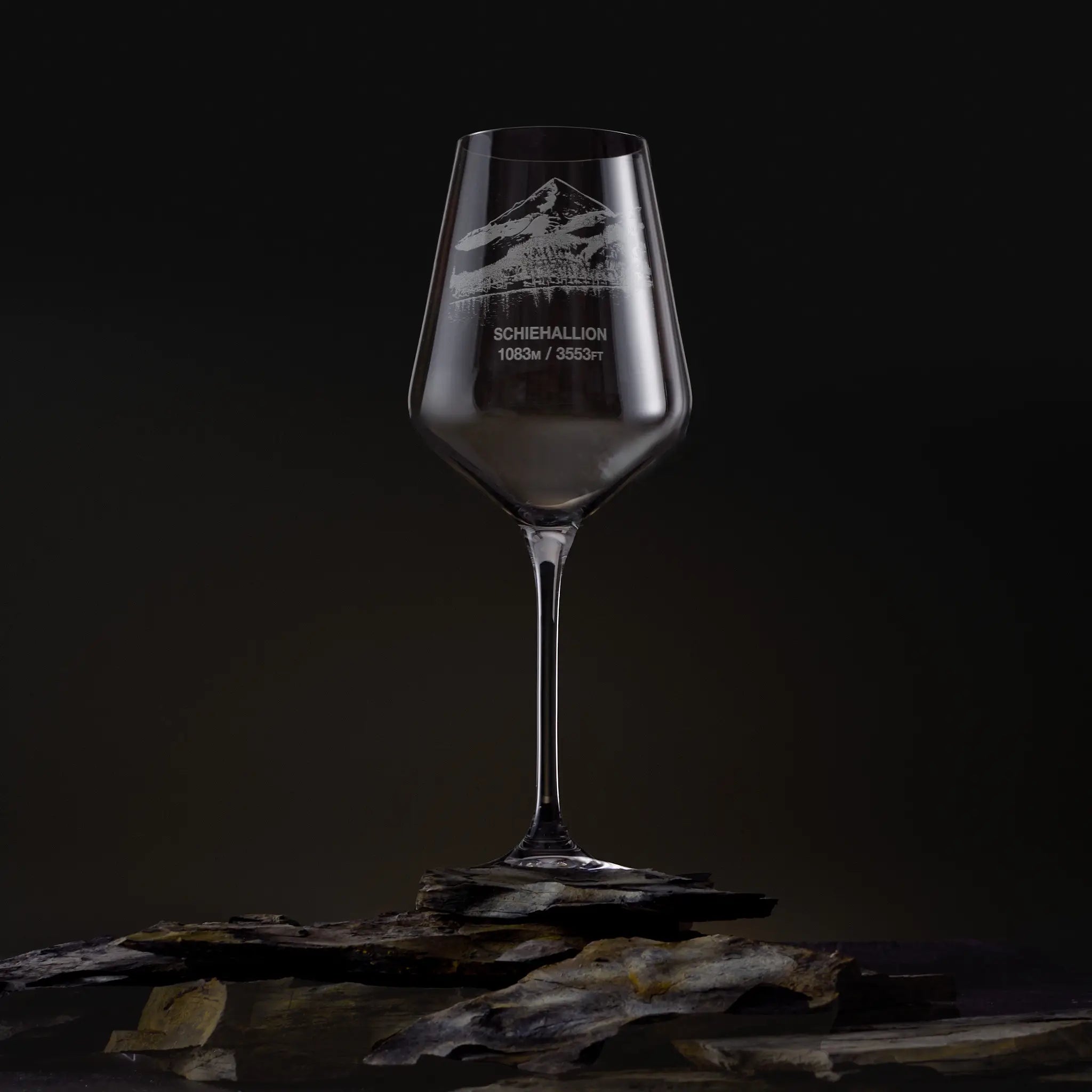 Hand-engraved Schiehallion wine glass on a dark, studio background