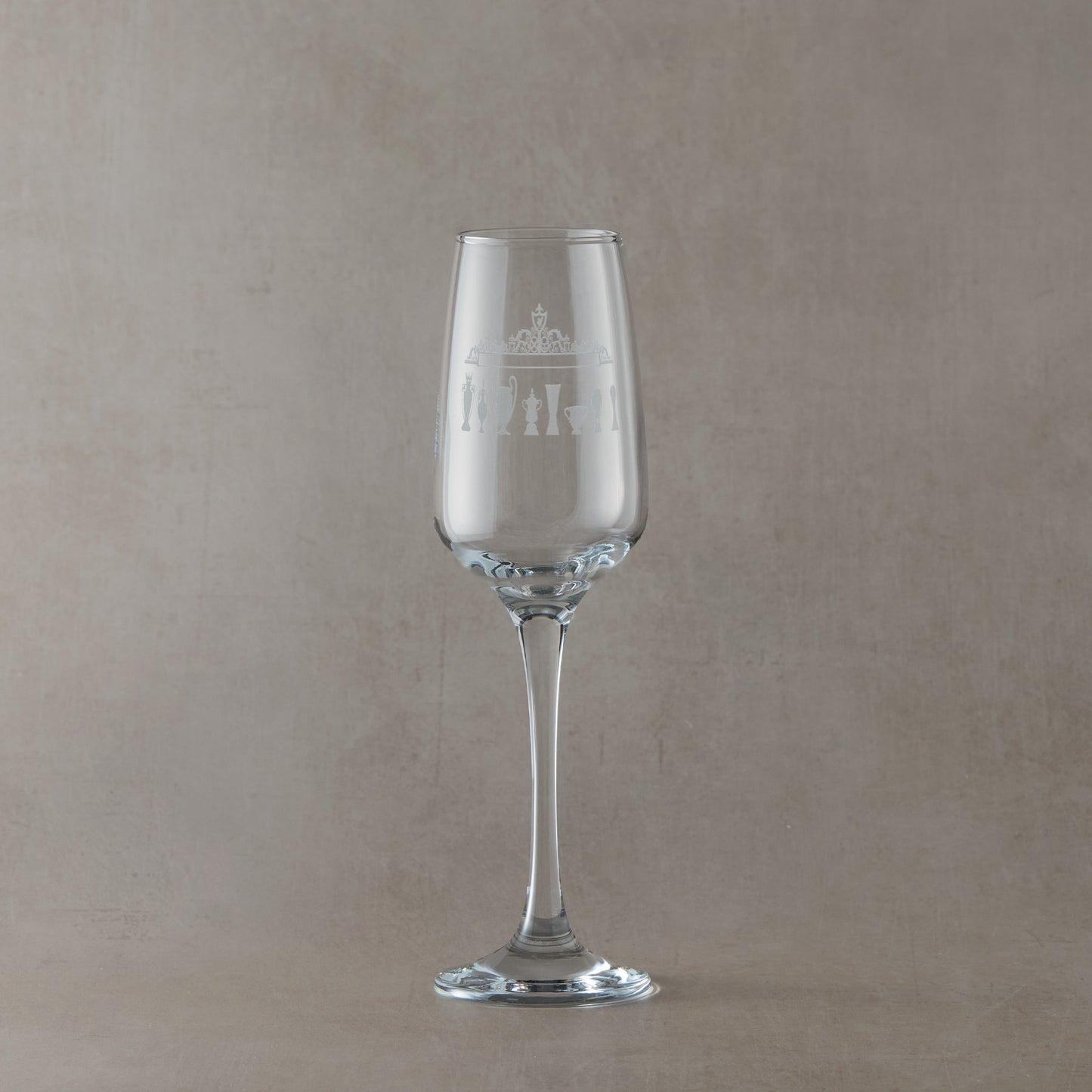 Engraved Prosecco glass with Shankly Gates entrance to Anfield football stadium and trophy silhouettes, shown front-facing.